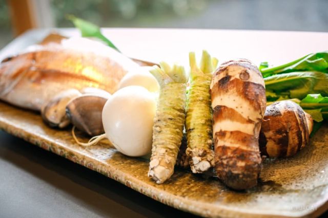 Fresh wasabi root and seasonal Kyoto vegetables served as part of traditional kappo cuisine