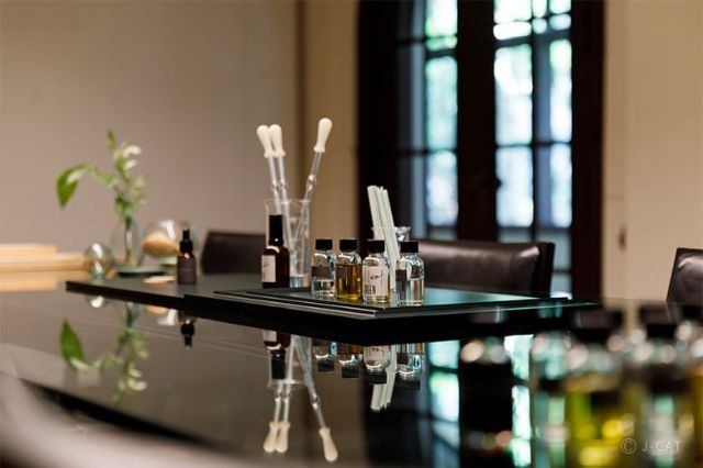 Essential oils and blending tools arranged in a calm Tokyo atelier during the Agreen Kudan fragrance experience.
