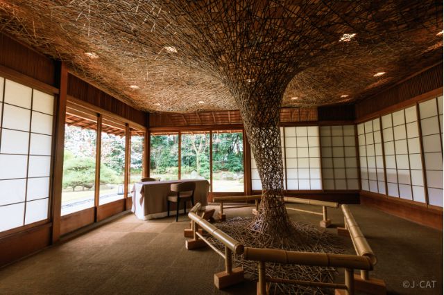 Interior of the Azumaya garden tearoom at The Garden Oriental Osaka, featuring traditional architecture and contemporary art installation.
