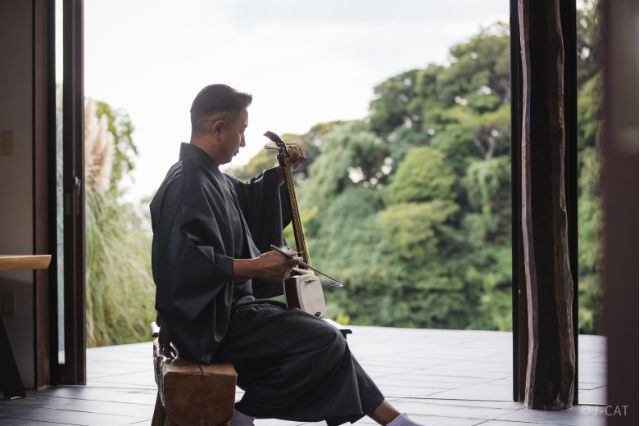 Traditional Japanese musician performing and teaching flute in Kamakura