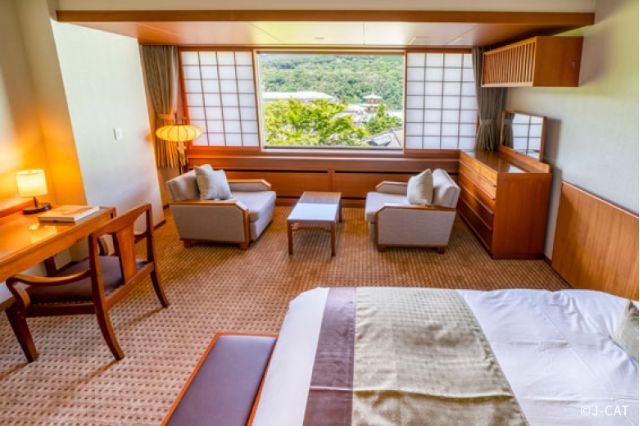 Traditional Japanese hotel room in Hakone with private onsen atmosphere and views toward Mount Fuji