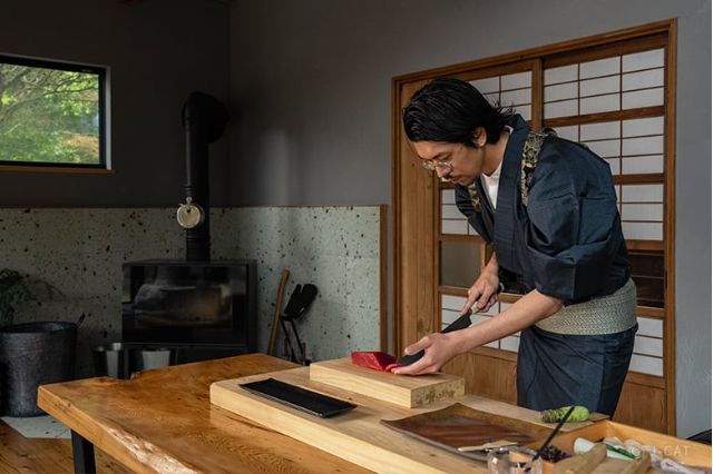 Japanese chef preparing sushi during a private sushi-making experience in Hakone