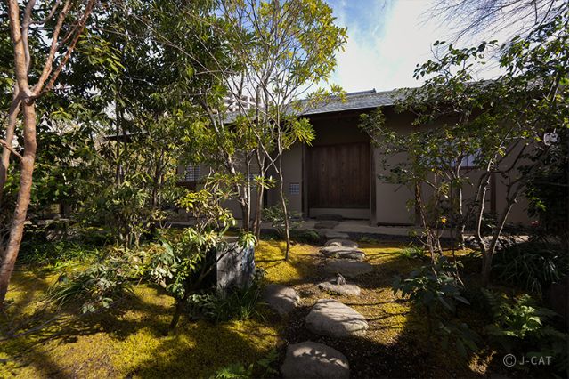 Traditional garden path leading to guest accommodation at Auberge Tokito in western Tokyo