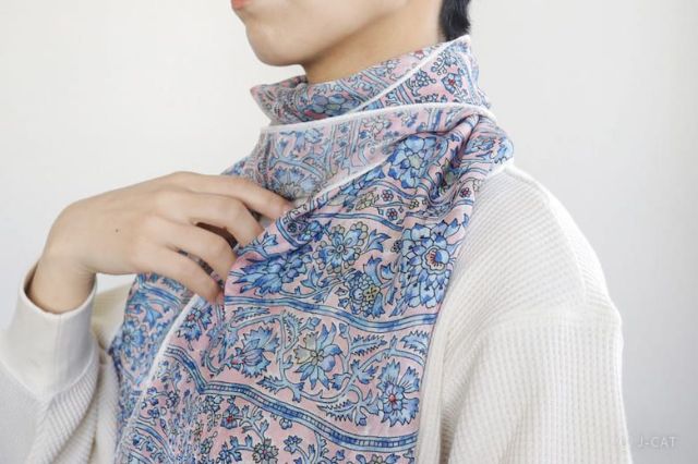 Person wearing a hand-dyed Japanese textile scarf created in a traditional Edo dyeing workshop in Tokyo