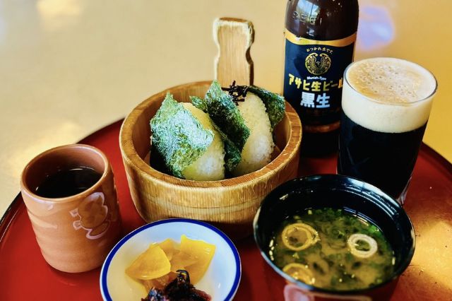 Rice balls with miso soup and beer served at a Japanese golf club restaurant