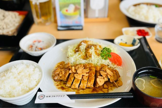 Tonkatsu pork cutlet with garlic slices, rice and miso soup at a Japanese golf course