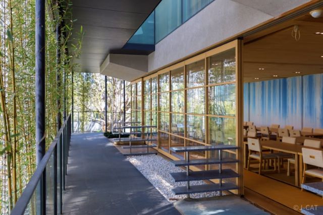 Modern Japanese pavilion beside a bamboo garden in Tokyo, setting for a refined seasonal dining experience