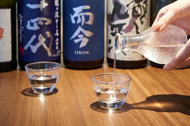 Rare Japanese sake tasting in a private Tokyo dining room with premium bottles and glass pour
